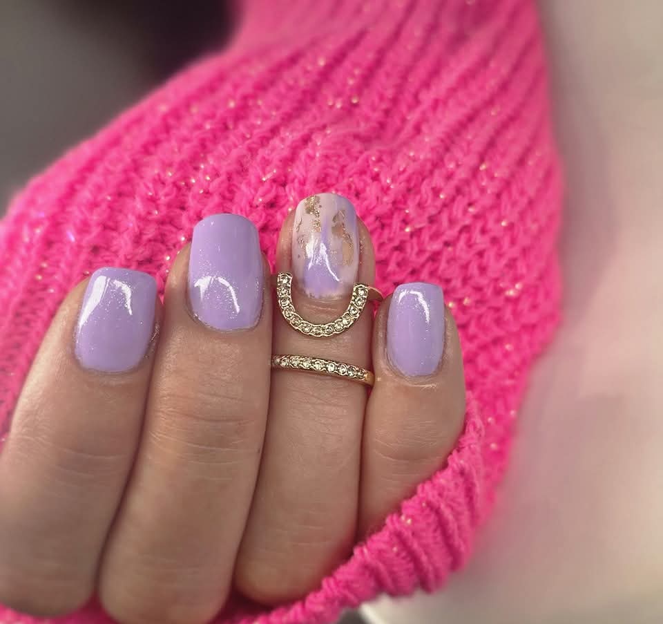 Glossy pale pink almond gel nails on silk